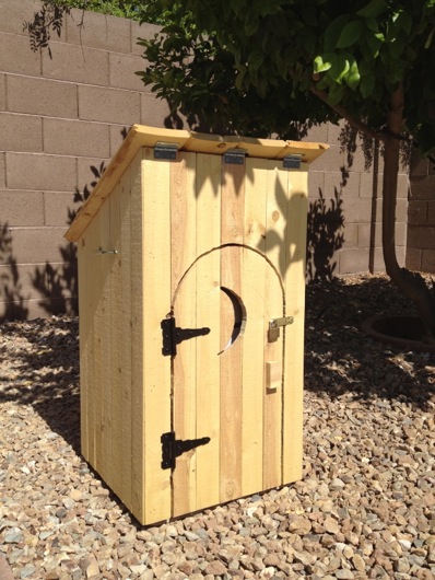 Completed gas tank outhouse with decorative hardware