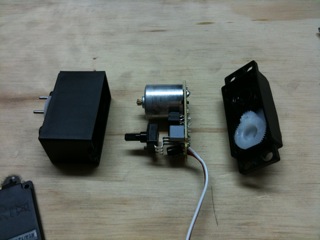 Shimmy the neato circuitry and motor guts out of the plastic case.
