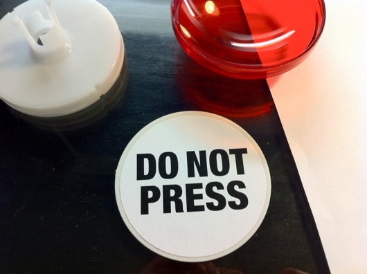 Warning label for dome button