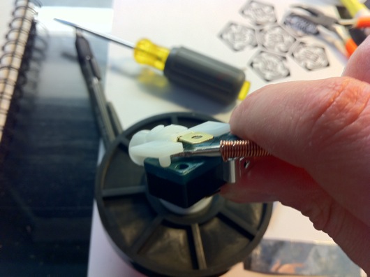 Pry off plastic switch/bulb holder