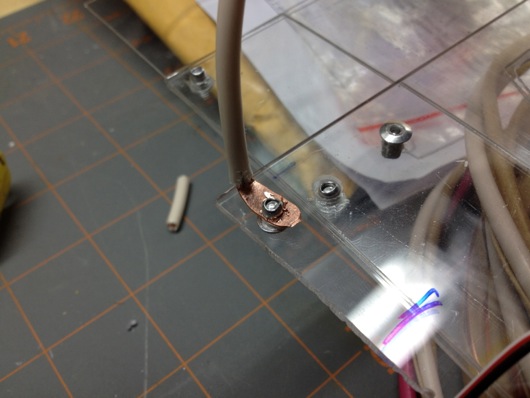 Copper rib bent 90º and riveted to main plastic frame